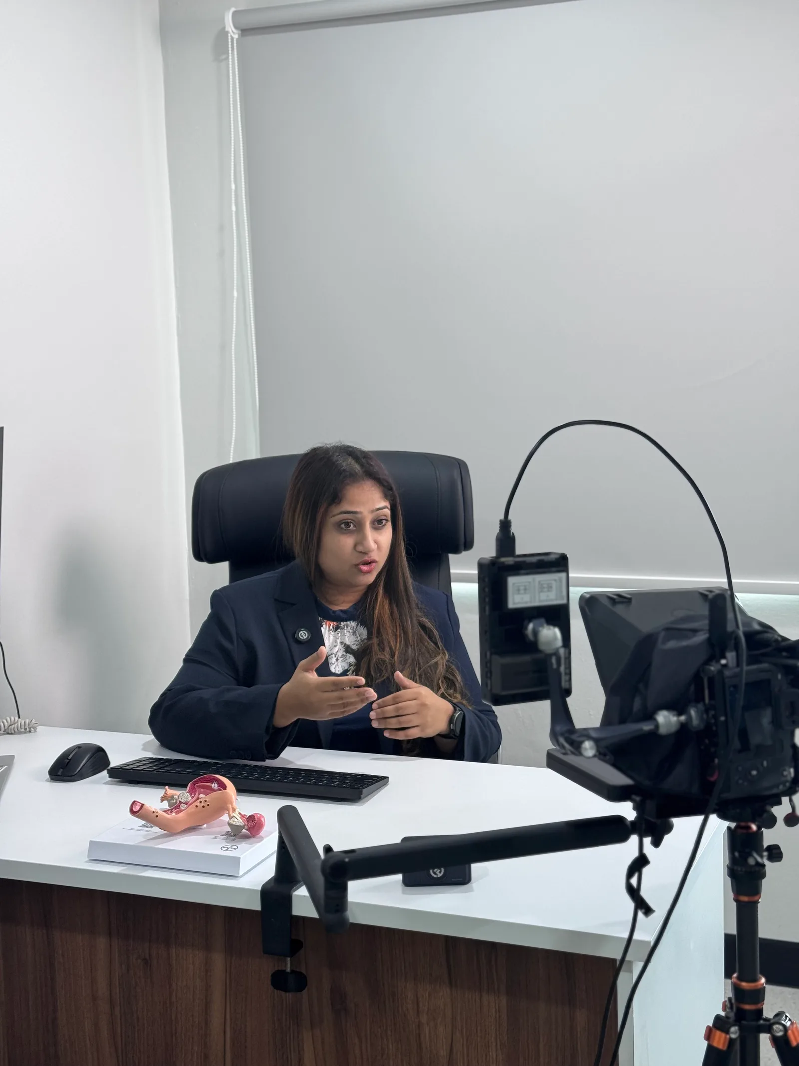 Dr. Bheena Vyjhallaja Karunyam recording educational content to a teleprompter during a Specialist House shoot