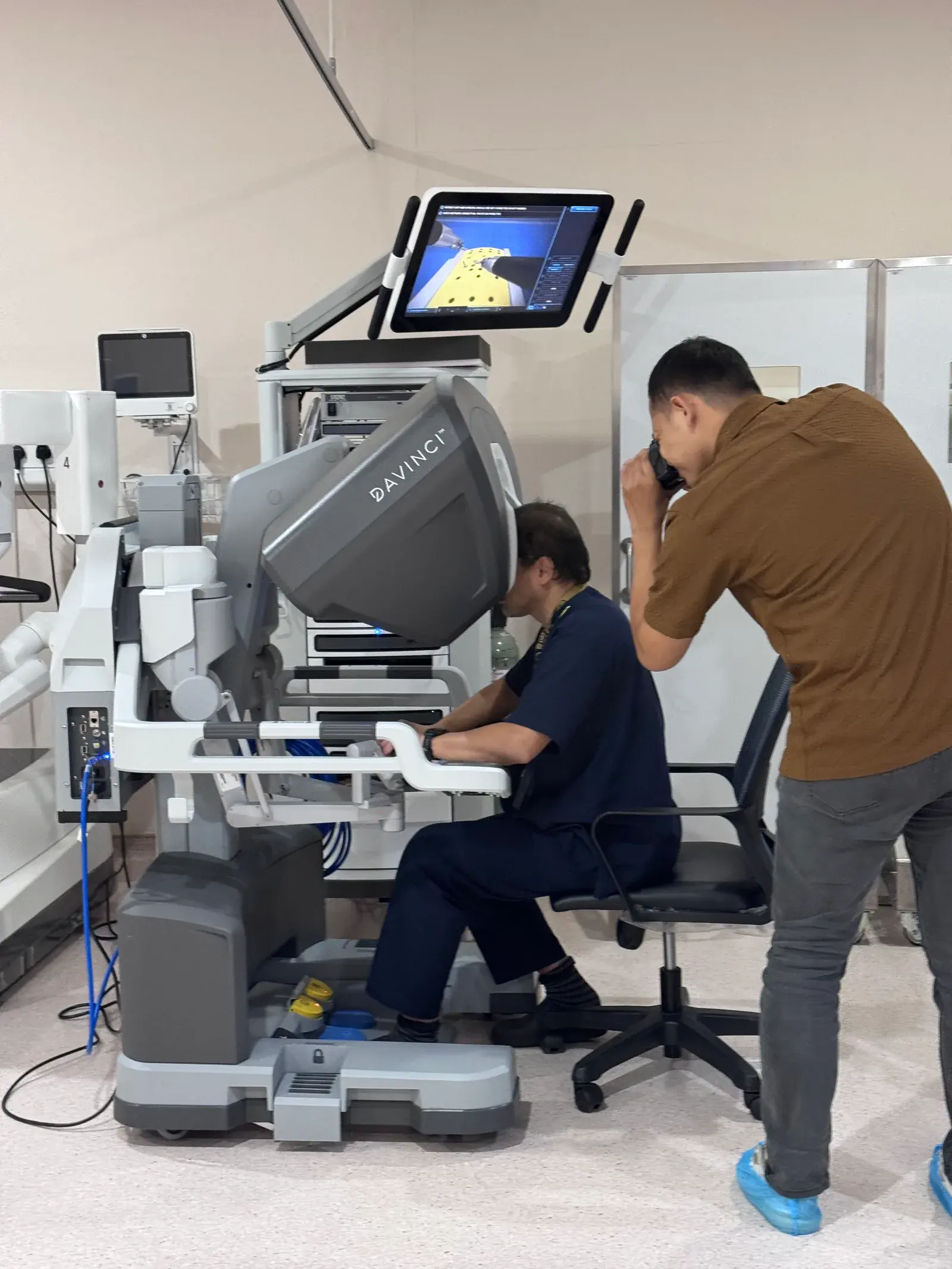 Prof. Dr. Shahrul Amry Hashim at a robotic surgery console